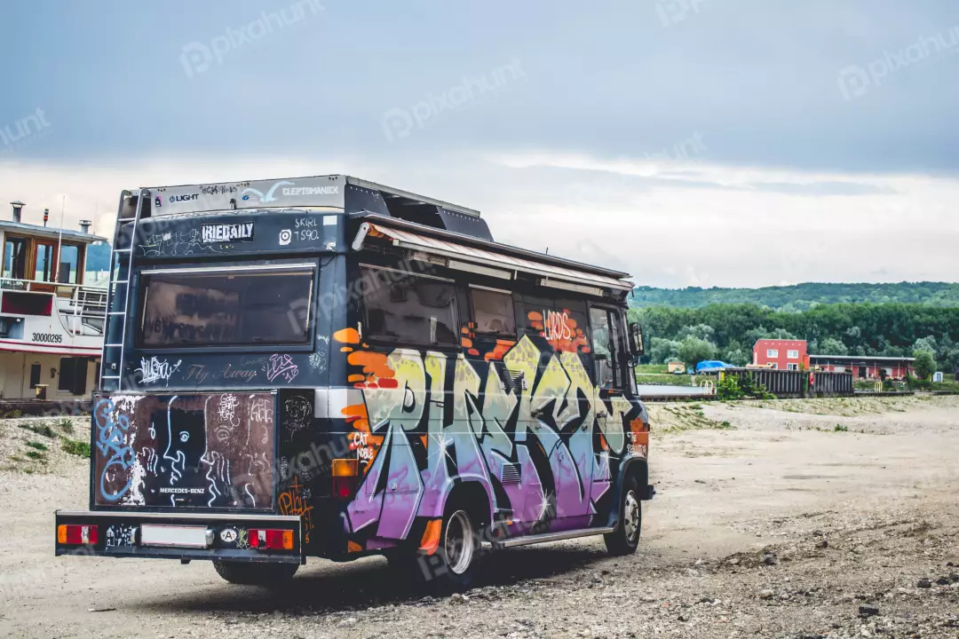 Free Premium Stock Photos a photograph of a van covered in graffiti