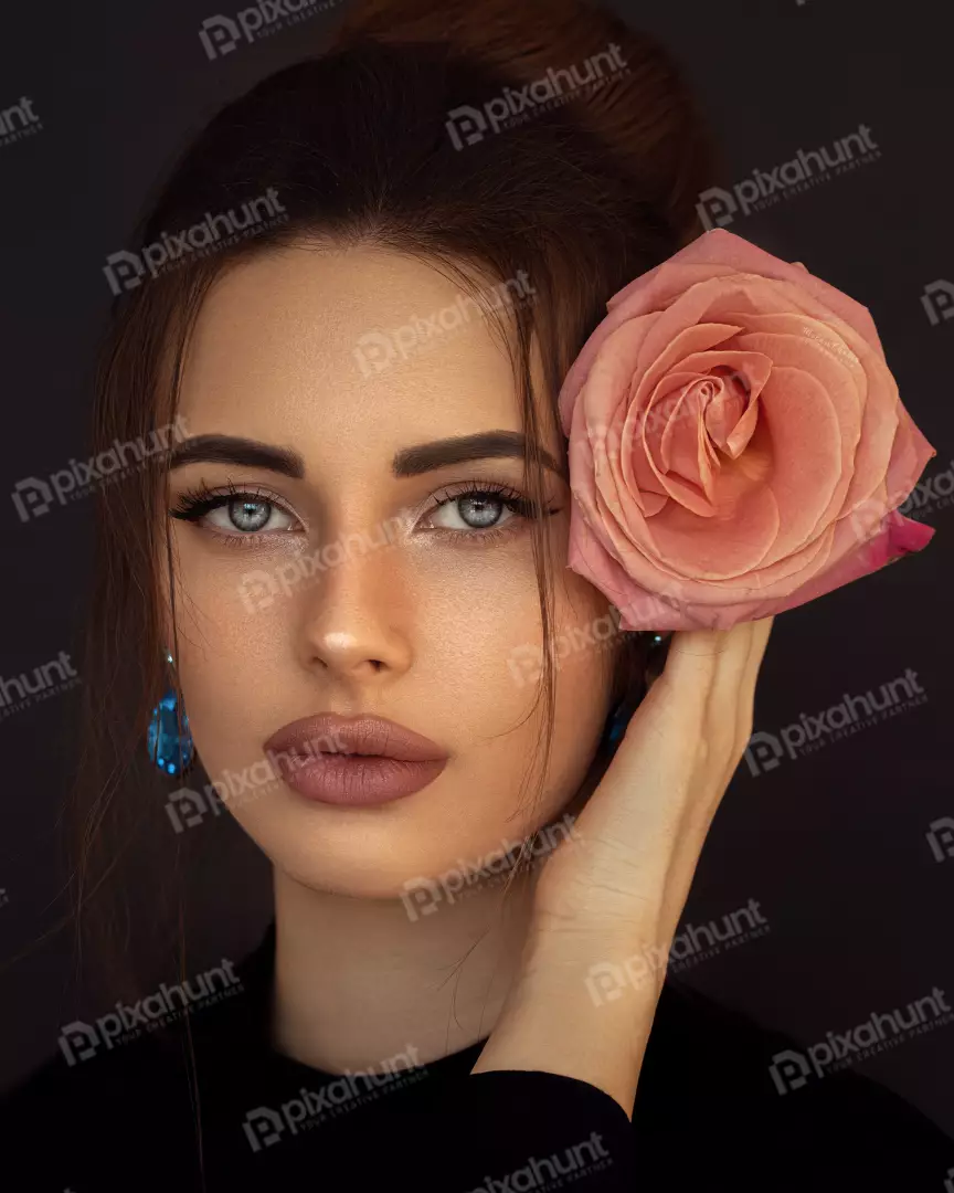 Free Premium Stock Photos A portrait of a young woman with long, dark brown hair and light blue eyes