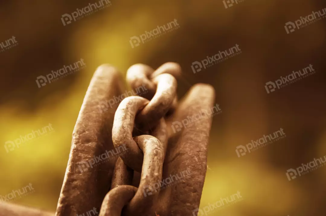 Free Premium Stock Photos A rusty chain wrapped around a metal spool