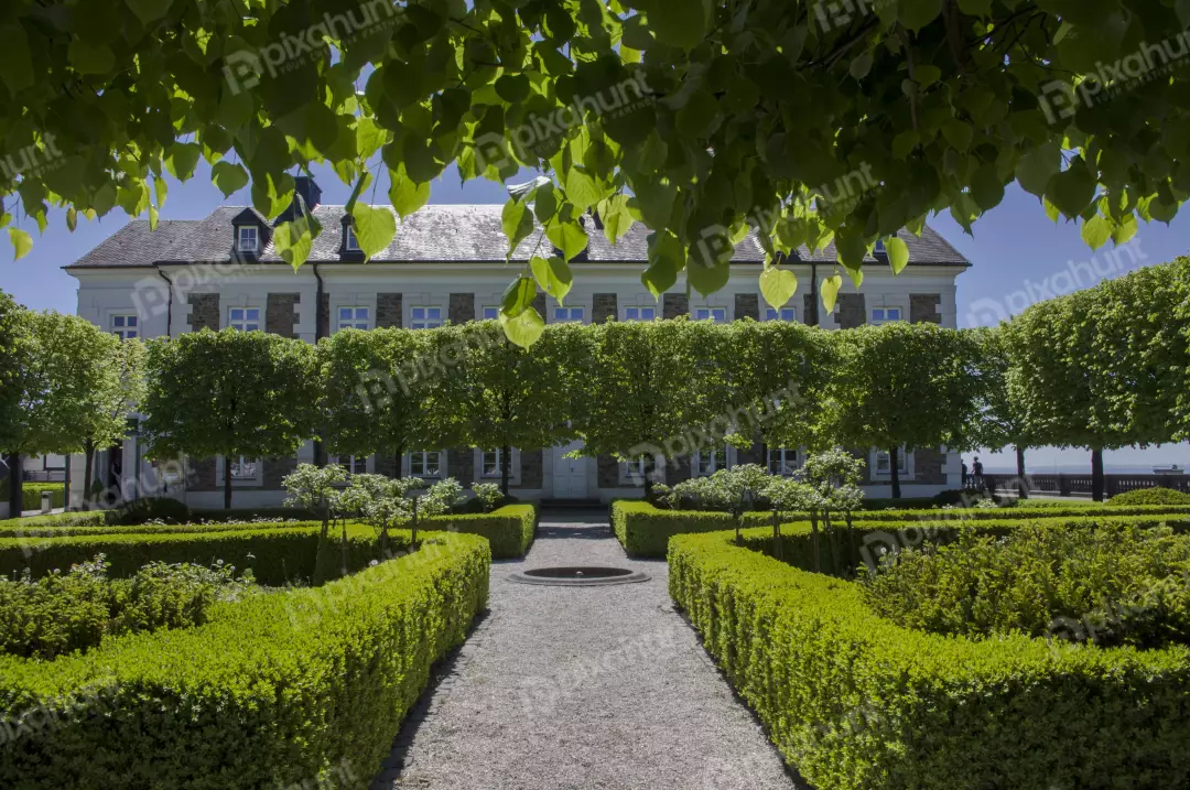 Free Premium Stock Photos Looking up at a grand house house is made of white stone and has a grey roof