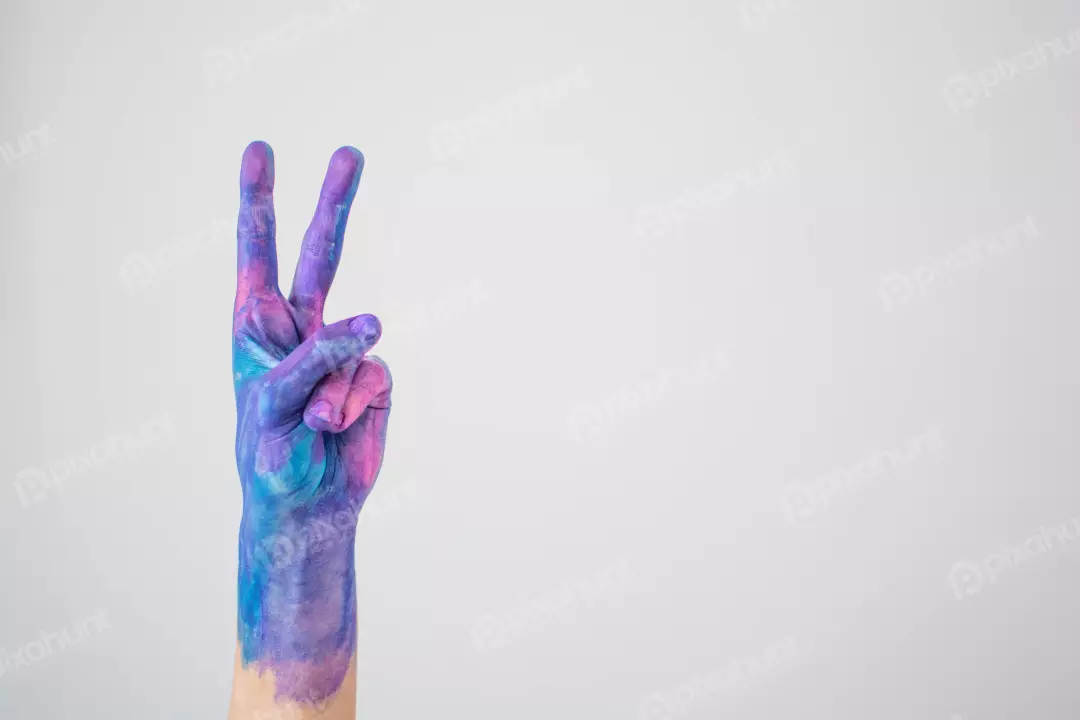 Free Premium Stock Photos A photograph of a hand painted in various shades of blue, purple, and pink