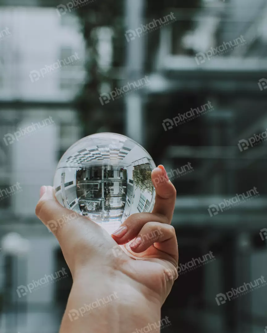 Free Premium Stock Photos a close-up of a hand holding a glass ball