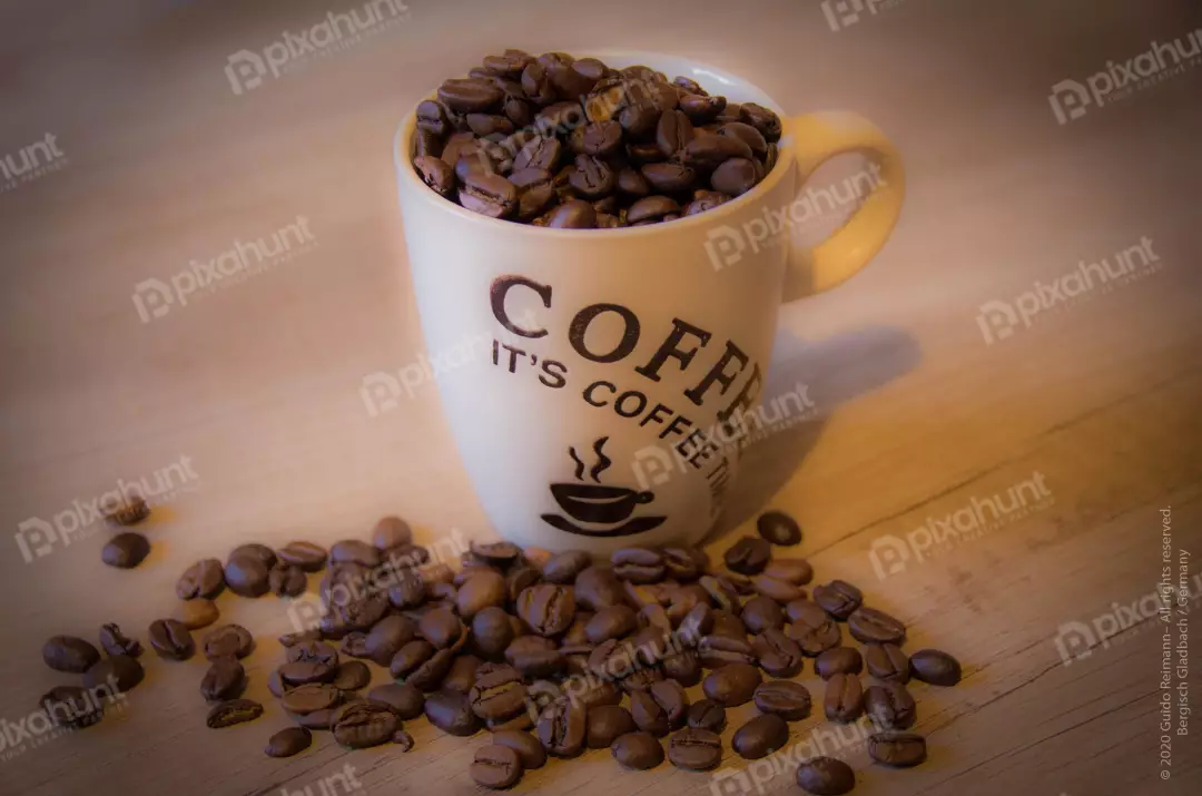 Free Premium Stock Photos A close-up of a cup of coffee beans