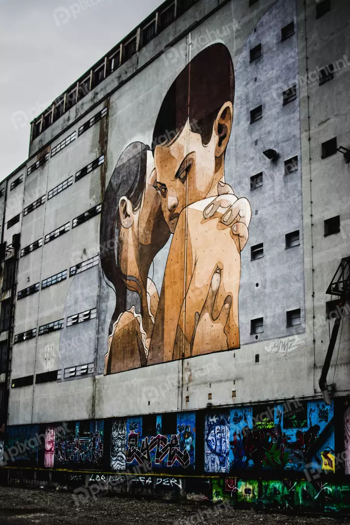 Free Premium Stock Photos A street art of a boy and a girl hugging each other