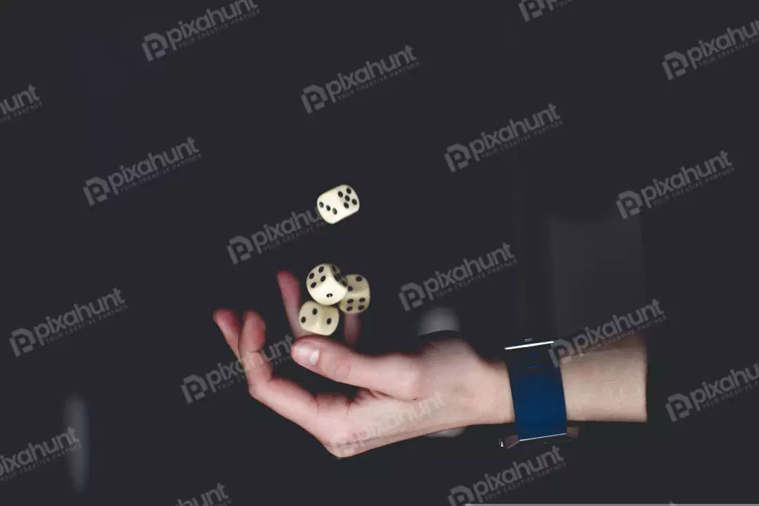 Free Premium Stock Photos a hand holding three white dice