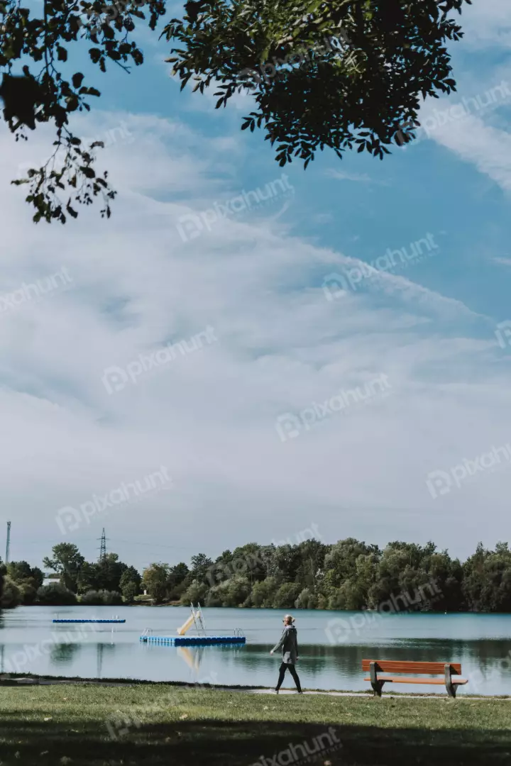 Free Premium Stock Photos a slightly elevated angle, looking down on a woman walking away from the camera