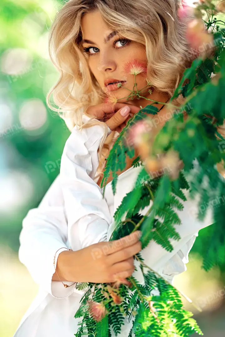 Free Premium Stock Photos A beautiful young woman with long blond hair and blue eyes