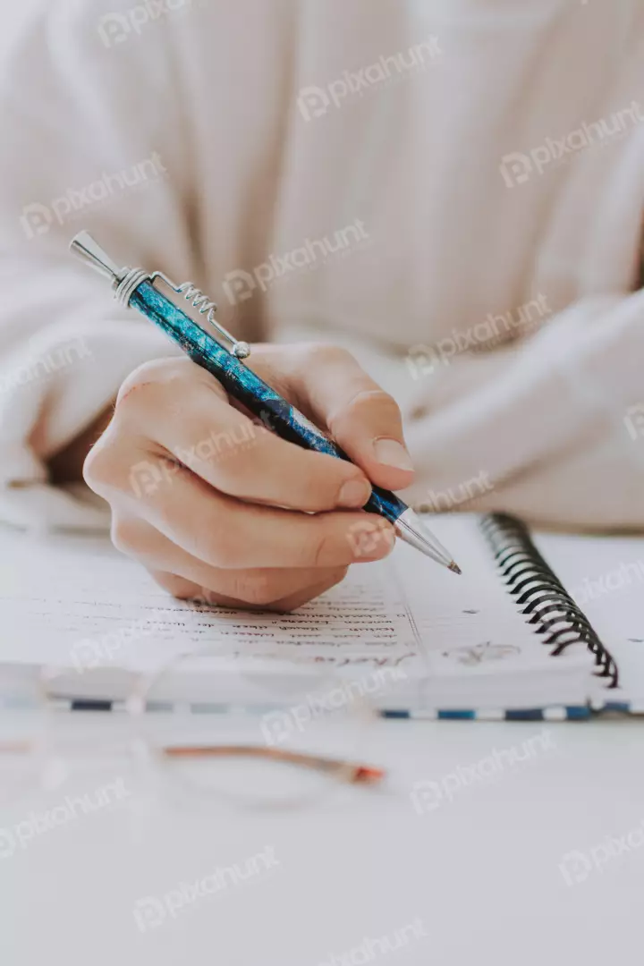 Free Premium Stock Photos a close-up of a person's hand holding a pen