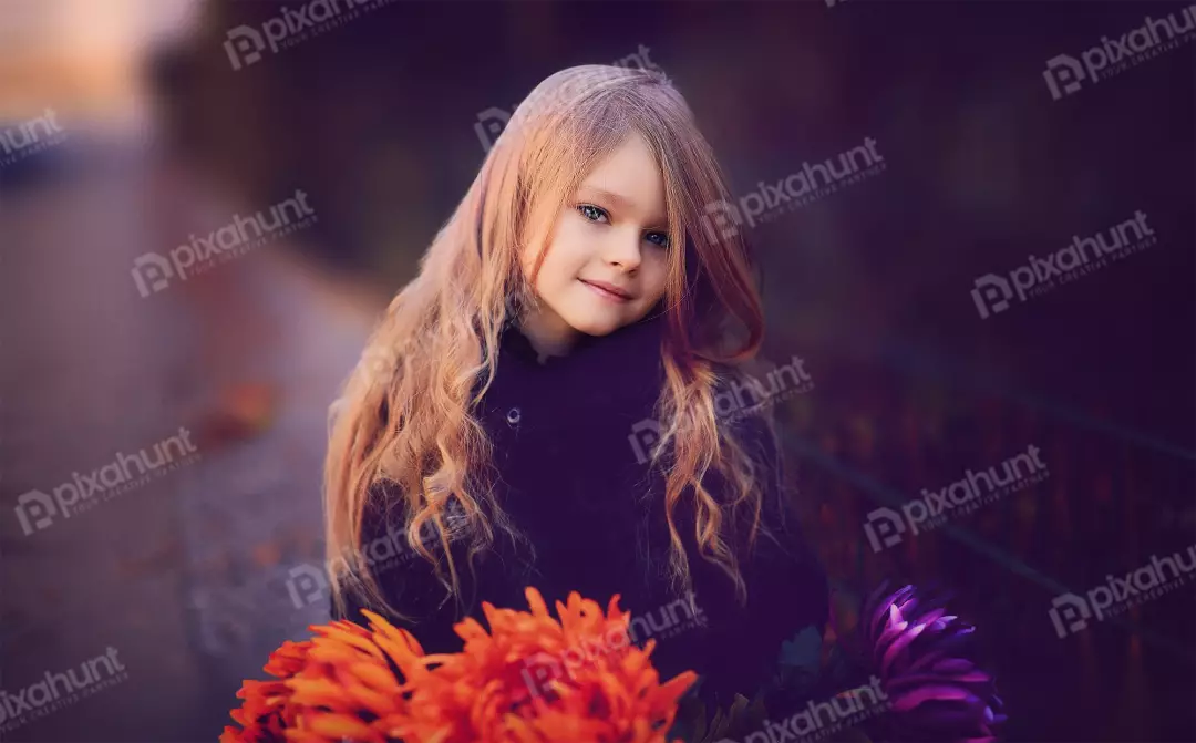 Free Premium Stock Photos The little girl is standing in front of a fence Also she is wearing a black coat and has long blonde hair