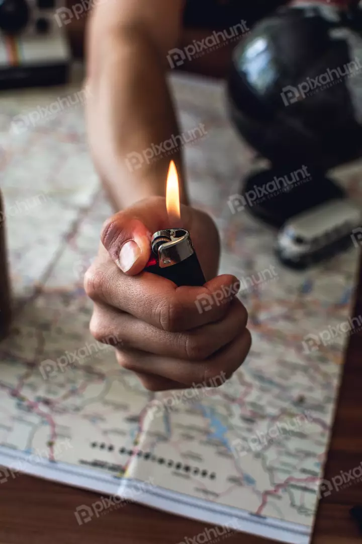 Free Premium Stock Photos a close-up of a hand holding a lighter