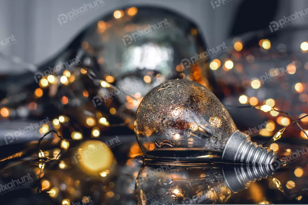 Free Premium Stock Photos a close-up of a light bulb with water droplets on it