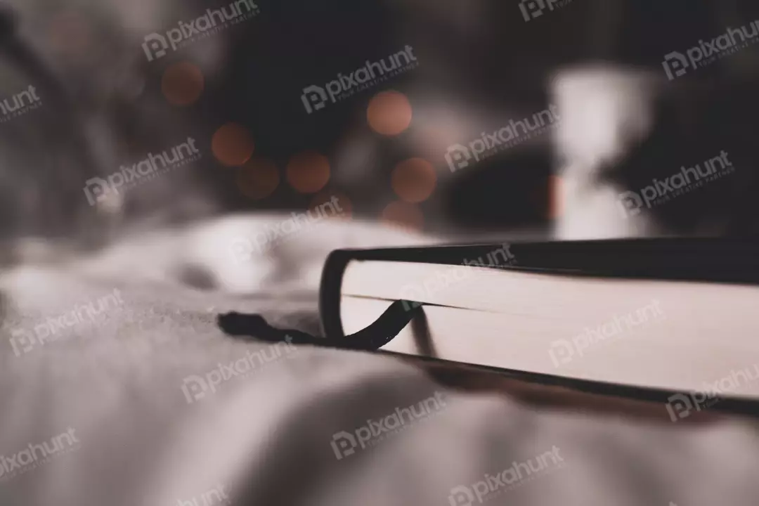 Free Premium Stock Photos  closed book lying on a white cloth