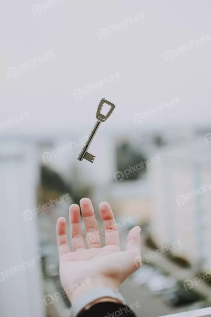 Free Premium Stock Photos The key is in the air, having been tossed from one hand to another