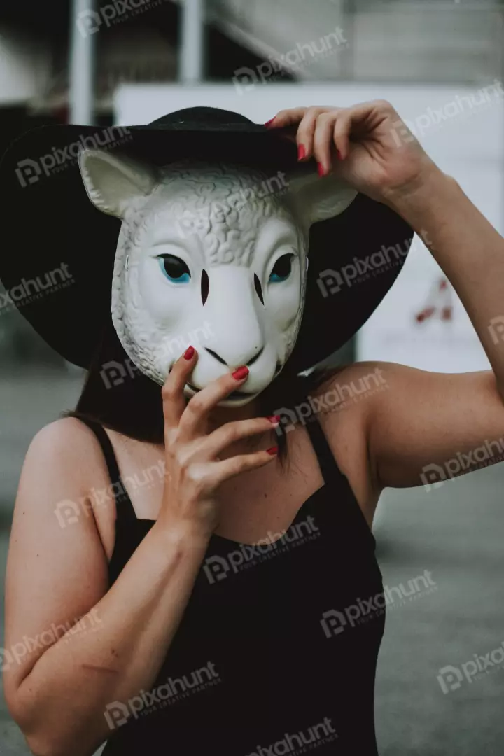 Free Premium Stock Photos Woman wearing a black hat and a white sheep mask