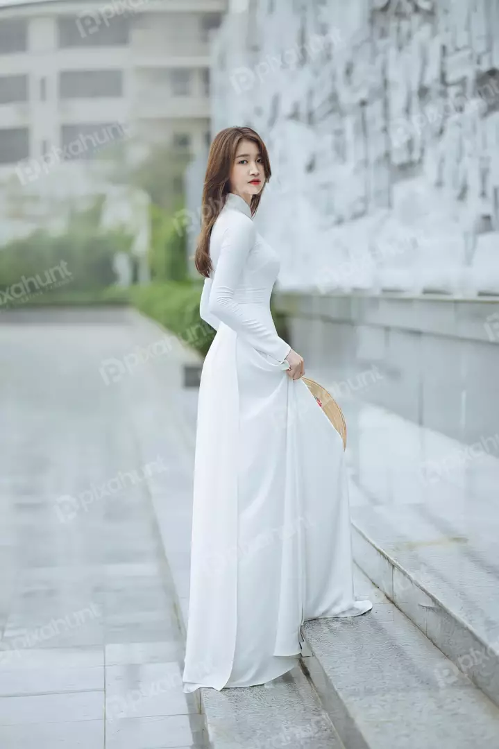 Free Premium Stock Photos The ao dai is a traditional Vietnamese dress. It is a long, flowing gown that is typically made of silk