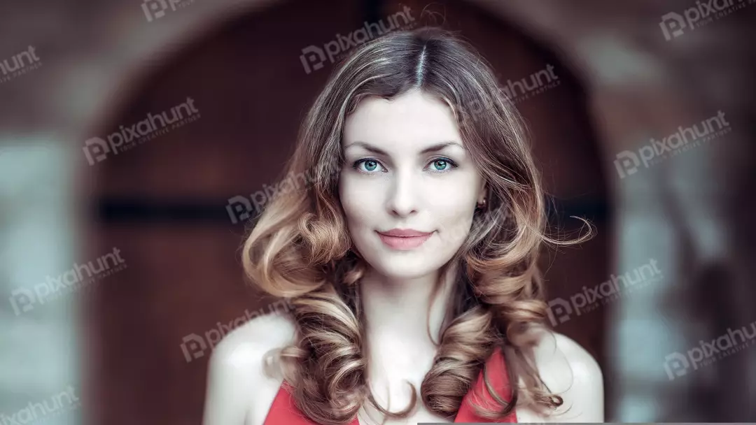 Free Premium Stock Photos A beautiful young woman with long, wavy brown hair