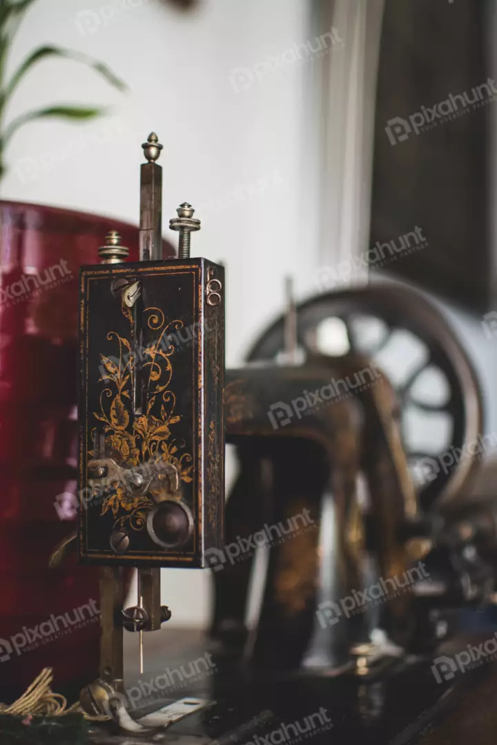 Free Premium Stock Photos Old sewing machine is made of metal and has a black color