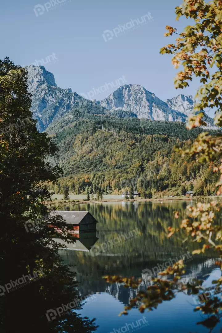 Free Premium Stock Photos Water is calm and clear, reflecting the sky and the surrounding mountains