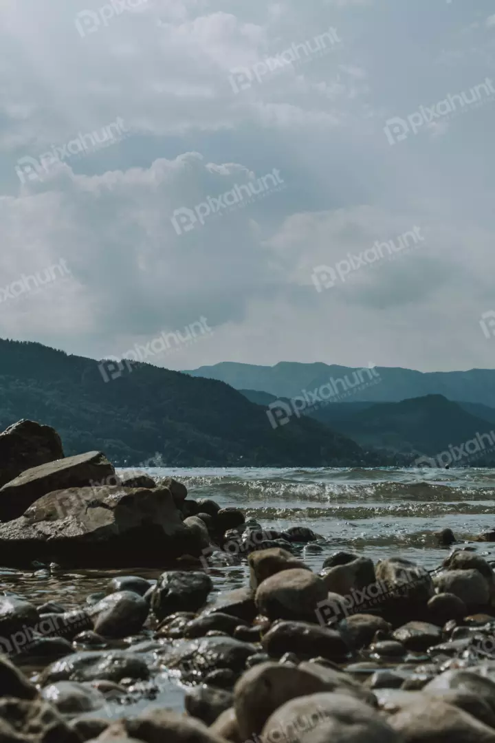 Free Premium Stock Photos angle allows the viewer to see the full expanse of the lake, as well as the mountains in the background