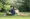 Man and woman sitting on a blanket in a park