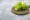 Wooden board on green bell peppers | Fresh green bell peppers placed on a wooden round board