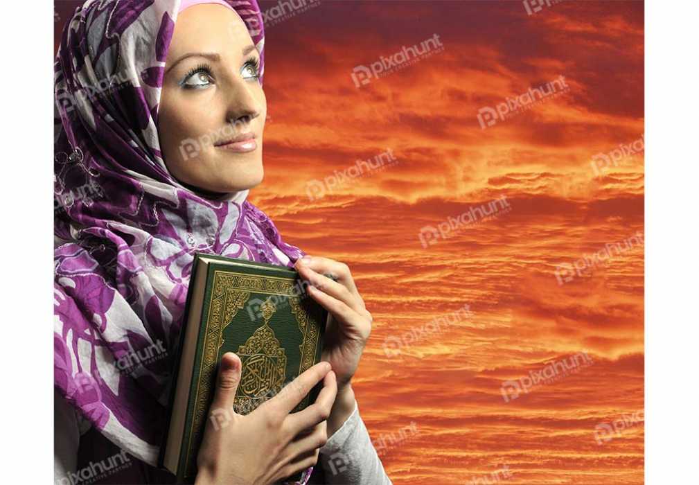 Free Download Premium Stock Photos | Adorable Girl Holding Holy Book Against Red Sky