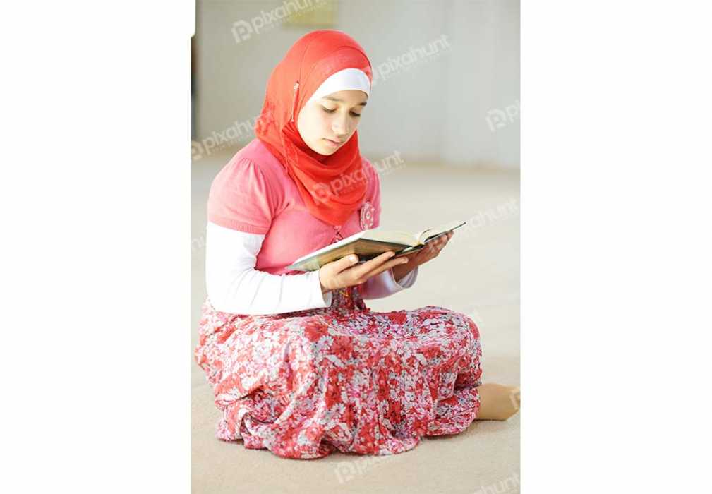 Free Download Premium Stock Photos | Muslim Girl Reading Islamic Holy Quran