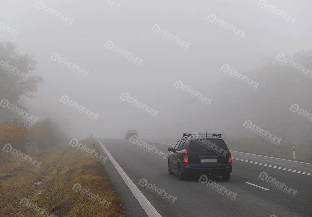 Free Download Premium Stock Photos | The fog autumn landscape dangerous road traffic in winter season | Car on the road