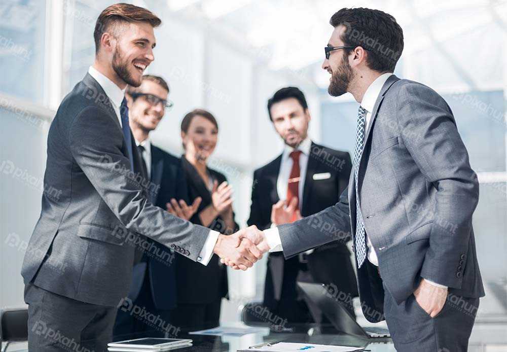 Free Download Premium Stock Photos | Handshake business partners standing | handshake of business people in a modern officeconcept of partnership