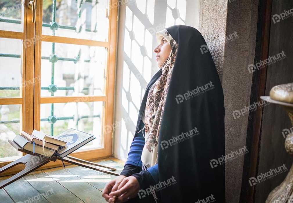 Free Download Premium Stock Photos | Muslim Woman Complete Reading The Holy quran